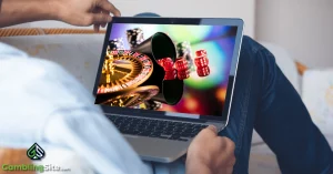Man Using Laptop to Play Casino Games - GamblingSite.com