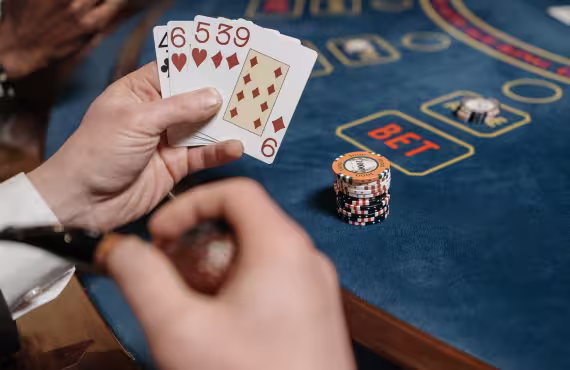 A Person Holding Playing Card