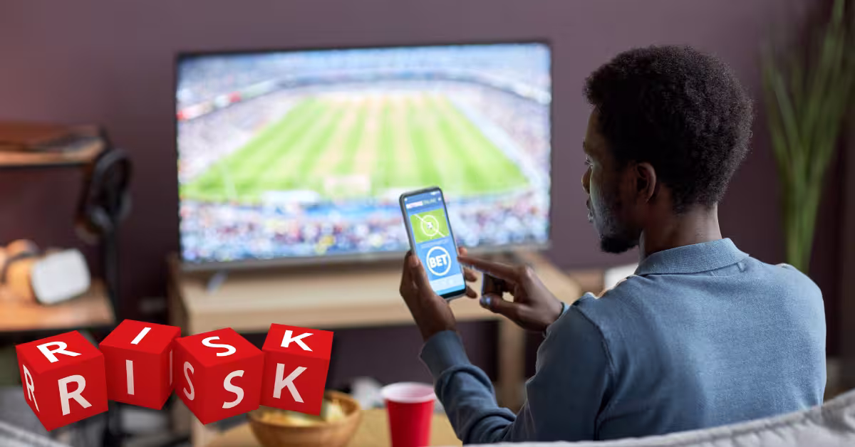 Man Holding Smartphone with Sports Bets App on Screen - Risk Red Blocks