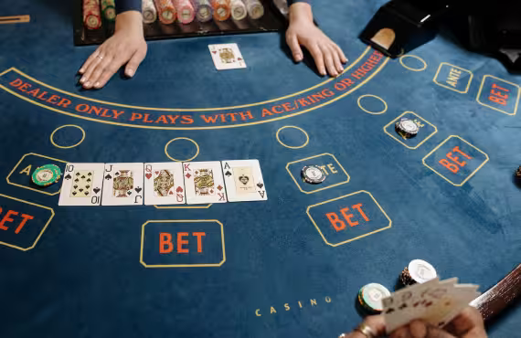 Cards and Casino Tokens on Baccarat Table
