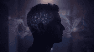 Silhouette of a person with illuminated brain neural pathways surrounded by casino symbols