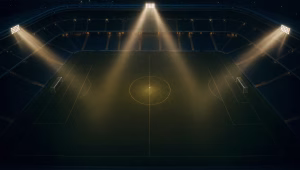 Three floodlight beams converging on a ball at the center spot of an empty night-lit soccer stadium